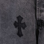 Chrome pants with cross patch on denim leg