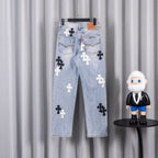 Light blue denim jeans with cross patches on back pockets.
