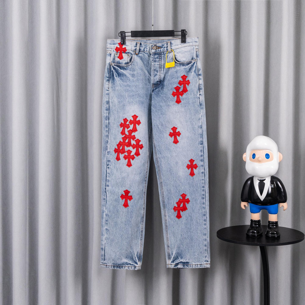 Light blue denim pants with red cross patches, straight leg, button fly