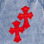 Light blue denim pants with three red cross appliques on upper leg