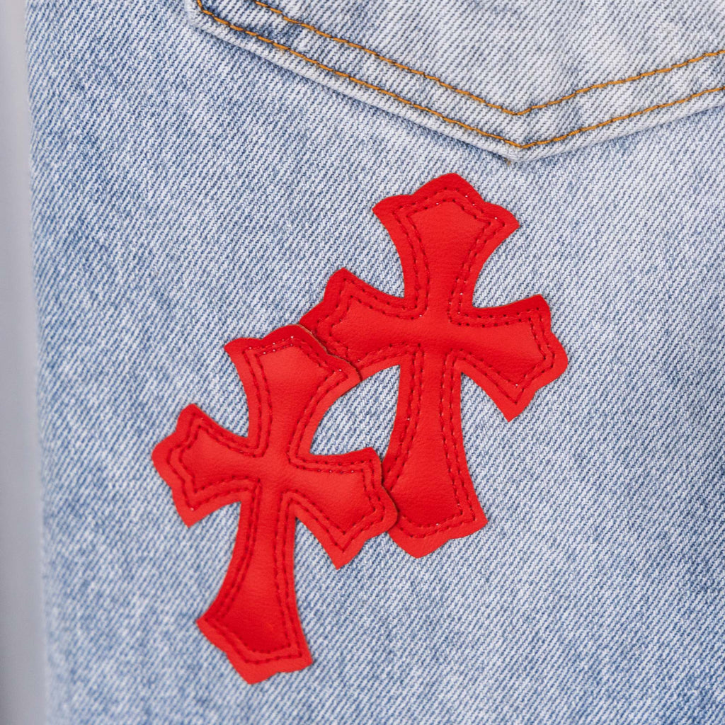 Chrome pants, light-blue denim with large red cross embroidery