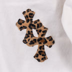 White pants with leopard print cross appliqué patch