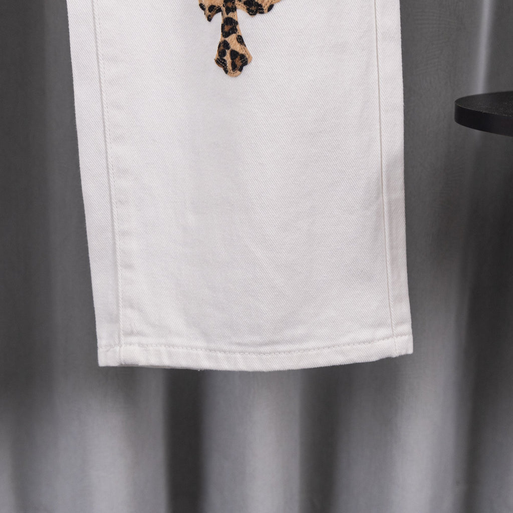 White denim pants hem with stitched seam detail