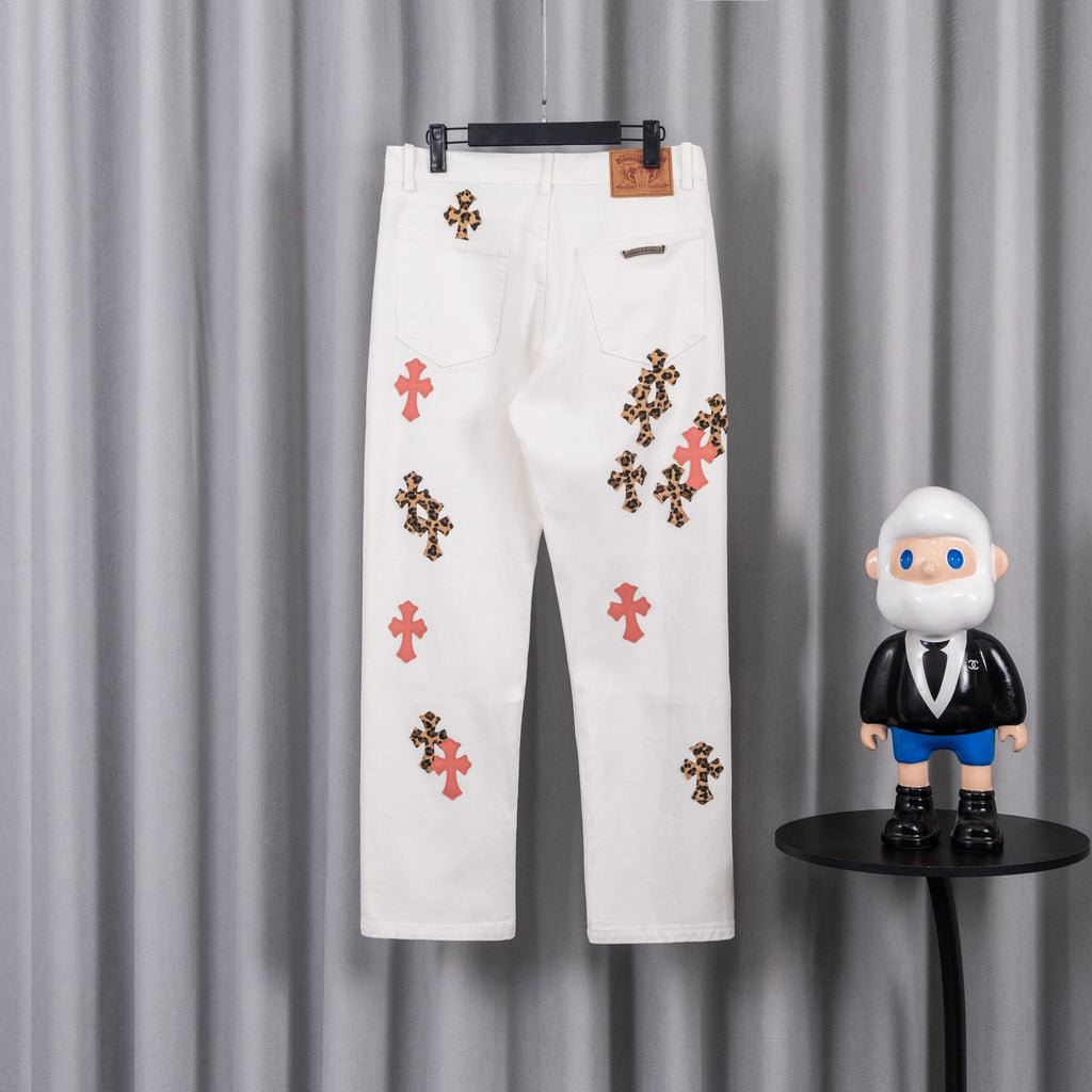 White denim pants with leopard and red cross patches, button fly