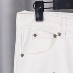 White denim pants with metal button closure and slanted front pockets