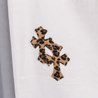 White denim pants with leopard print cross applique on leg