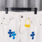 White denim pants with blue cross print, waist detail with yellow tag