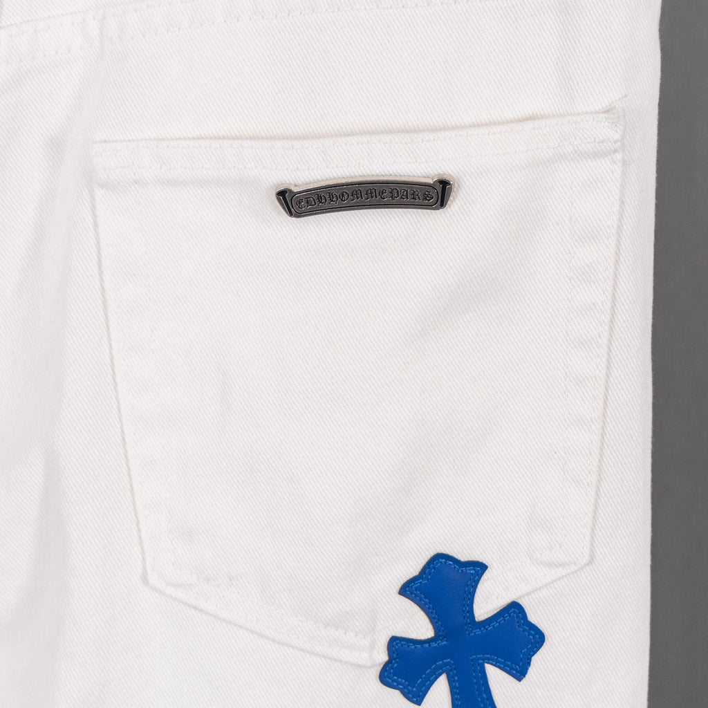 White denim pants with small black logo patch on back pocket