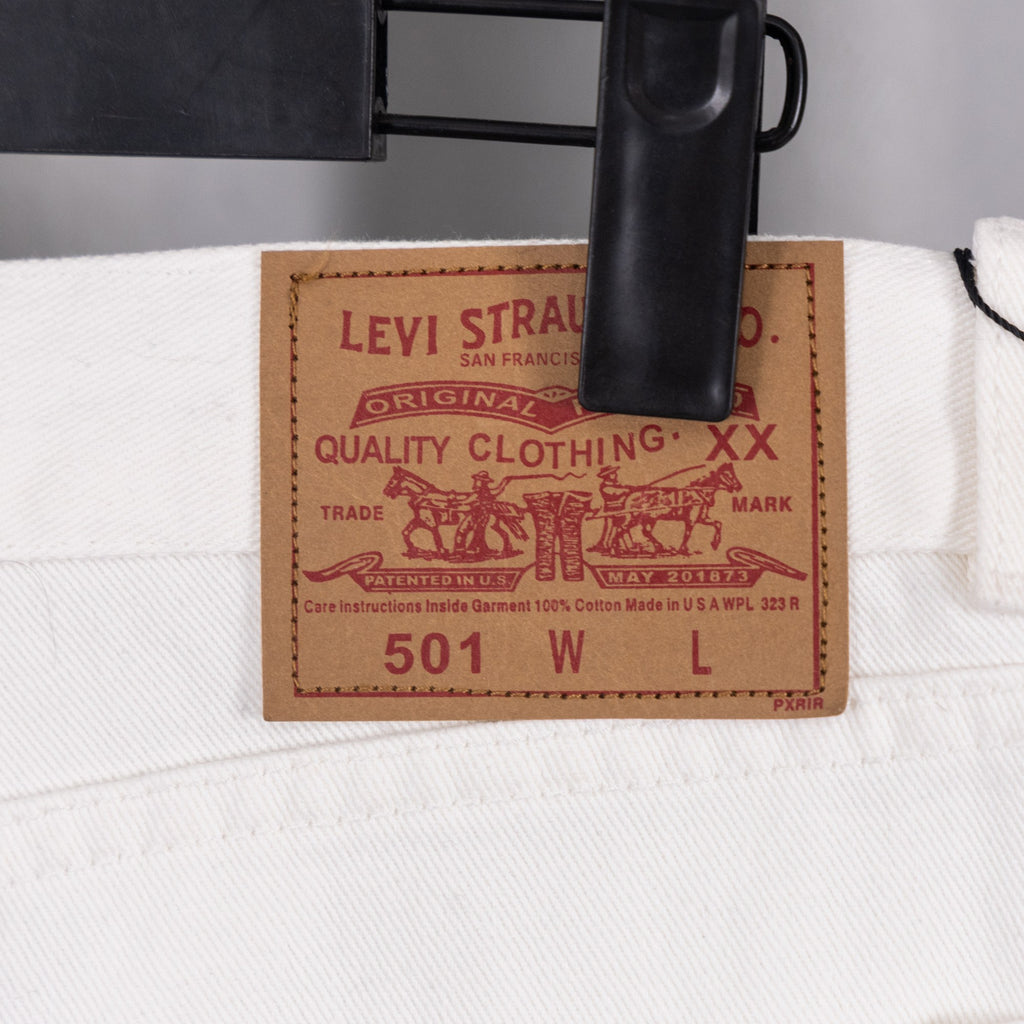 Levi Strauss 501 woven leather patch on white denim pants