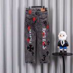 Dark gray denim jeans with red cross accents and black mirrored graphic on front