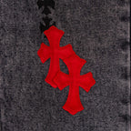 Black denim pants with red and black cross patches