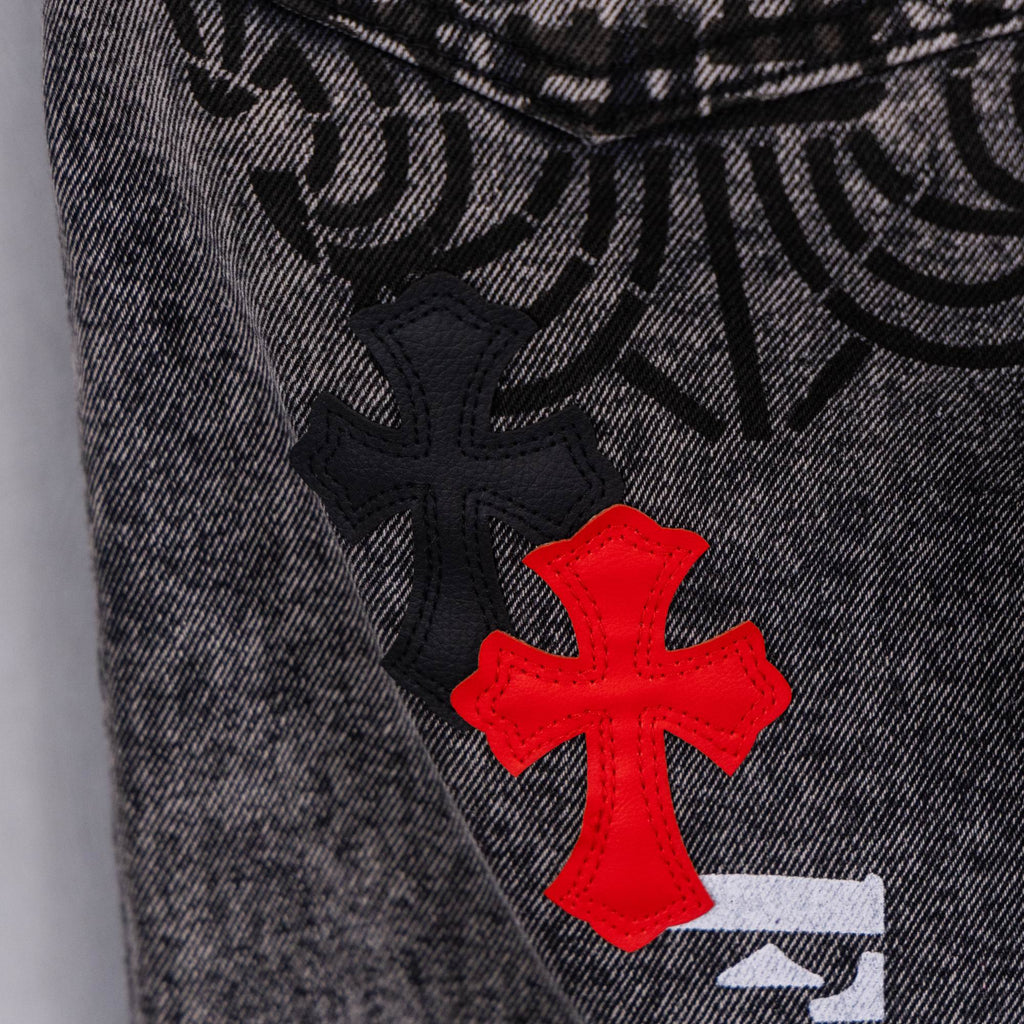 Dark gray denim jeans with black cross patch and red cross overlay graphic
