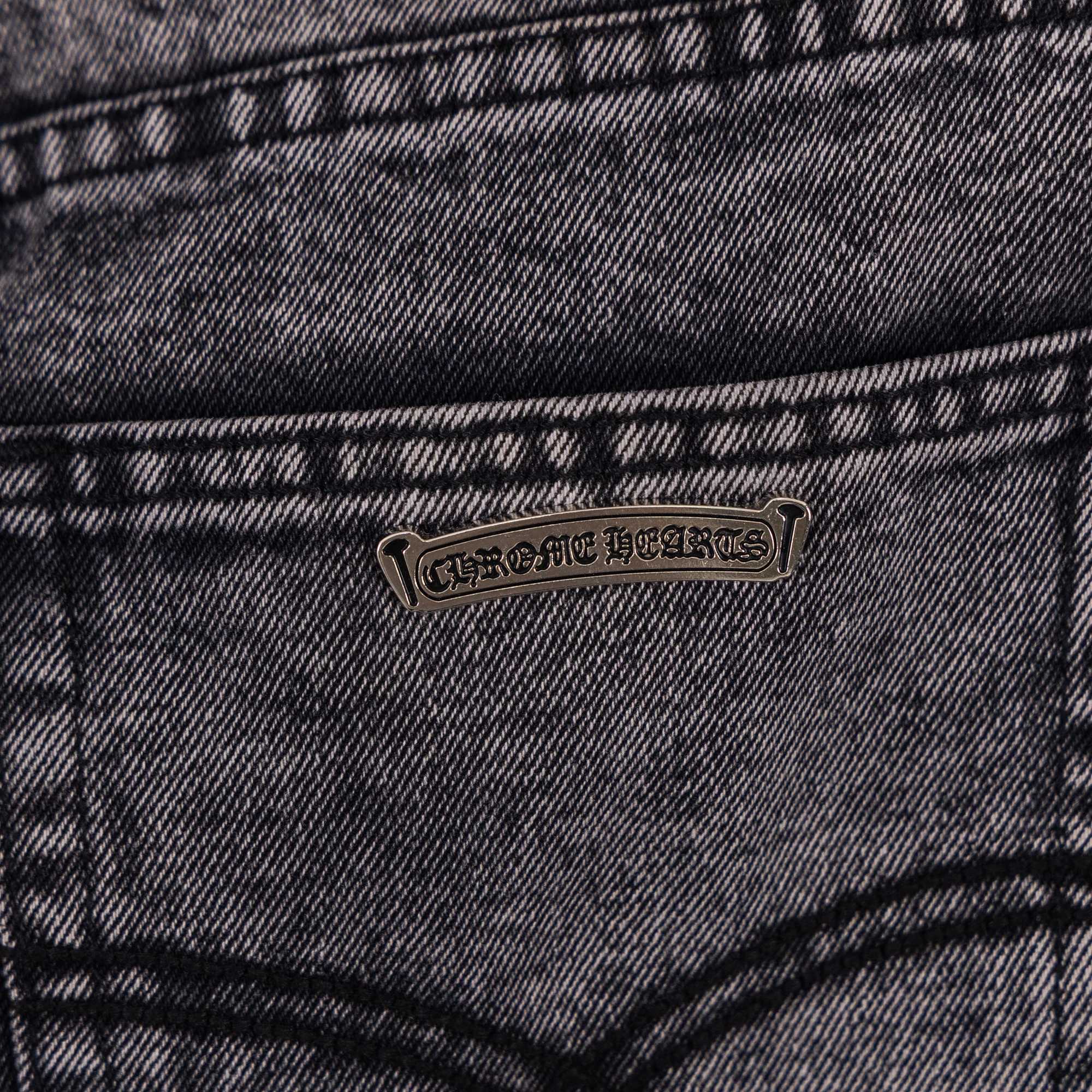 Dark gray denim jeans with small logo patch on front pocket