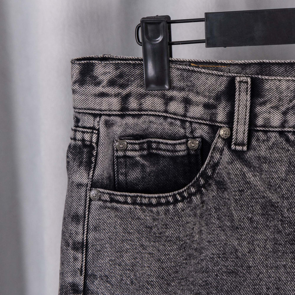 Black denim pants waistband with button fly and belt loops