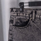 Black denim pants waistband with button fly and belt loops