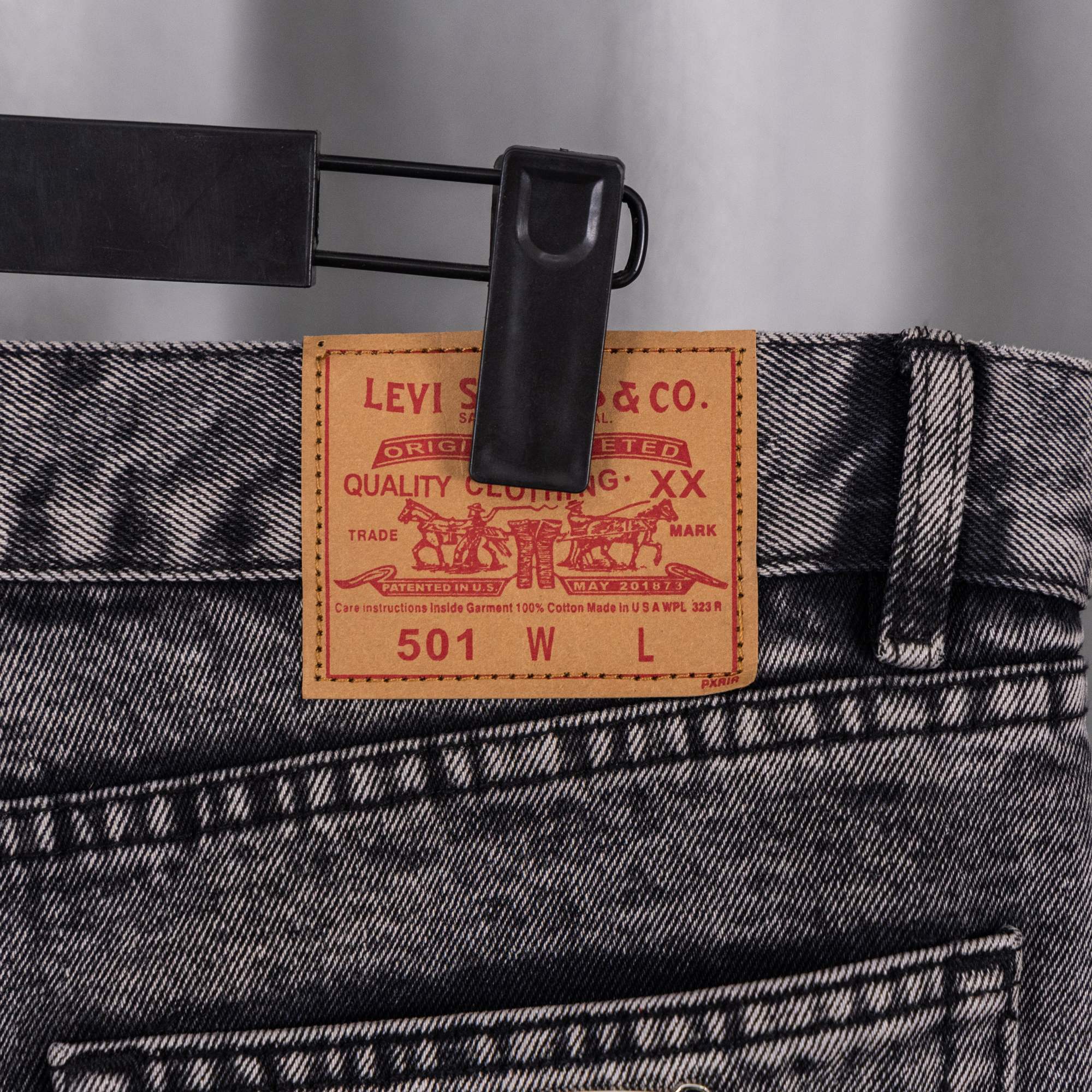 Levi's size label on dark denim waistband with stitched belt loop