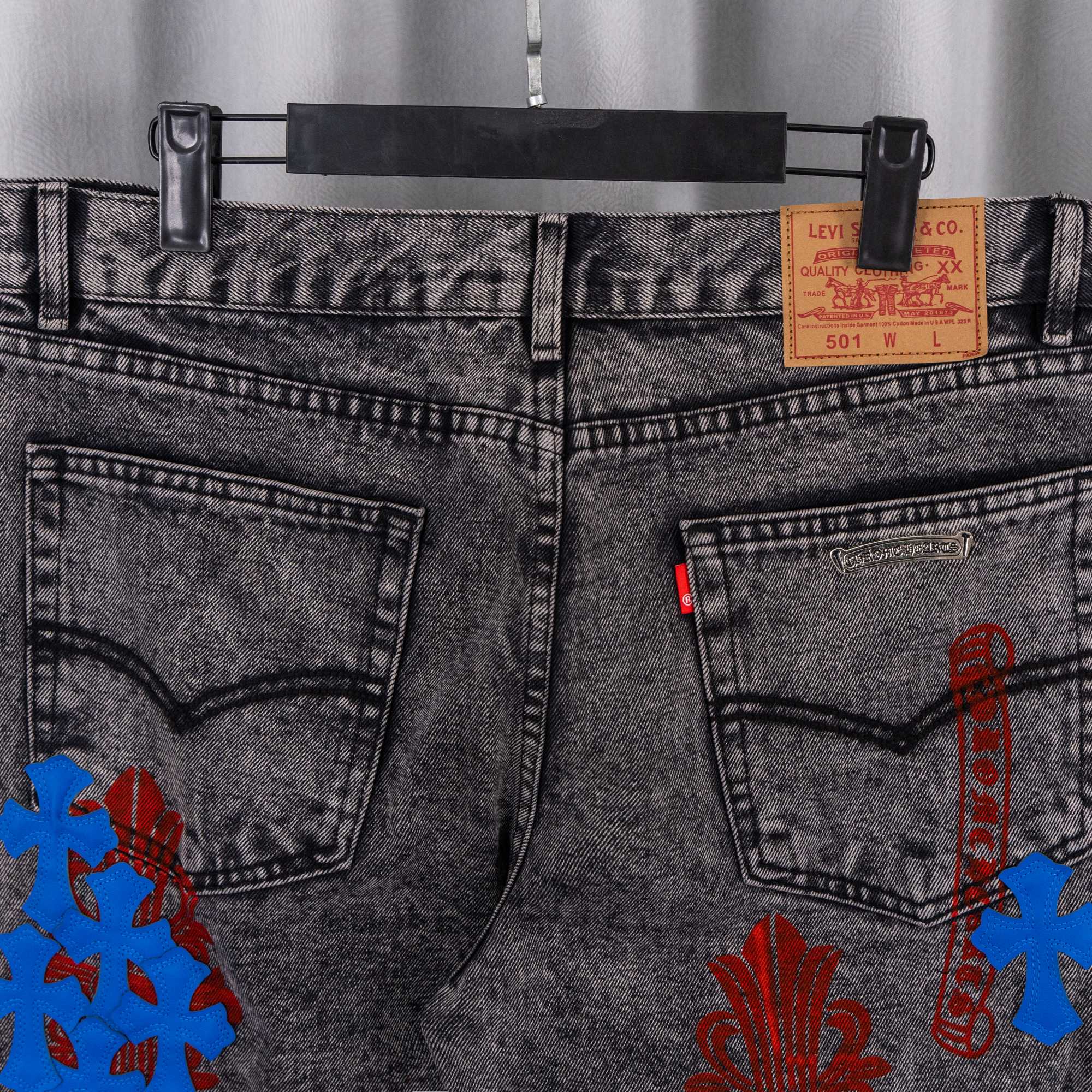 Dark gray denim pants with front pockets and Levi's 501 label