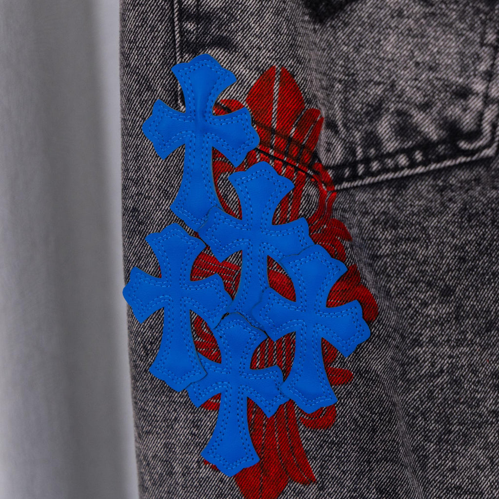 Blue and red graphic applique on dark gray denim pants leg