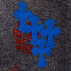 Chrome pants with blue cross appliques on dark denim