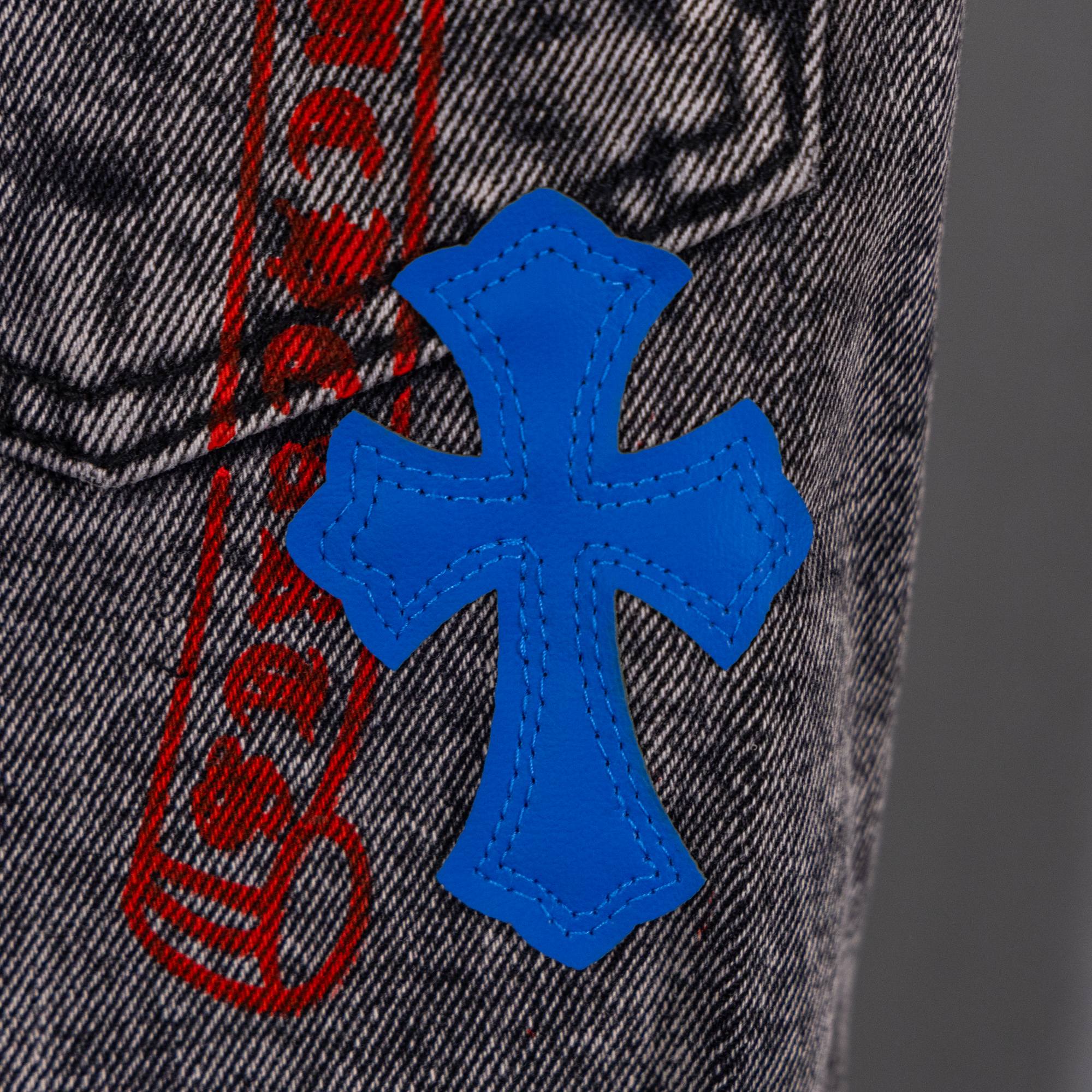 Blue cross applique on dark denim with red stripe graphic behind
