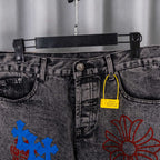 Dark gray denim pants with belt loops and yellow price tag near waistband