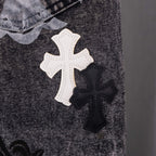 Denim close-up with white and black cross patches