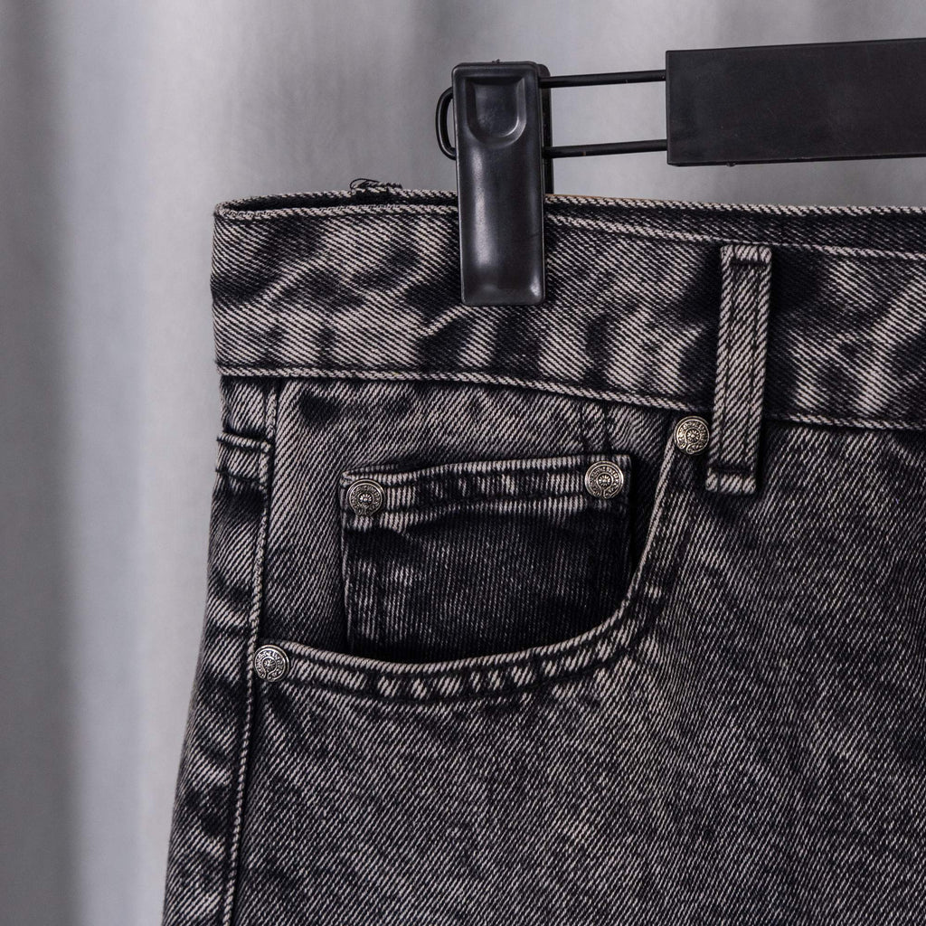 Dark denim pants front pocket with rivet button and stitched waistband