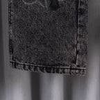 Dark wash denim pants hem detail with stitched cuff