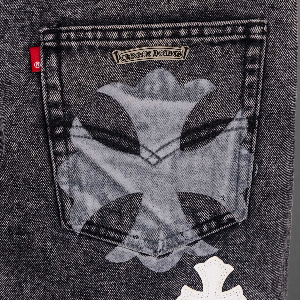 Dark denim pants with large pocket graphic and cross patch