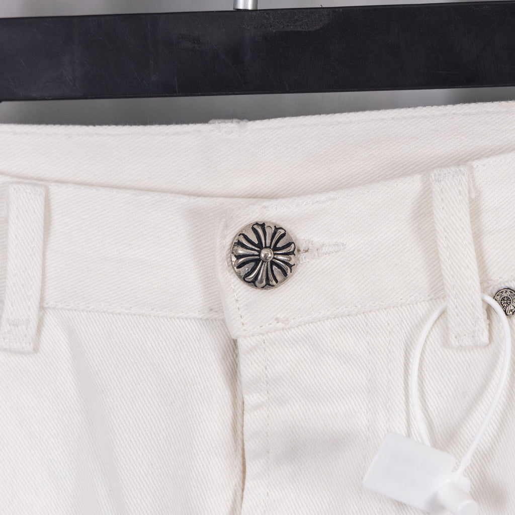 White pants with metal button and “Extra Vert Very” label on waistband