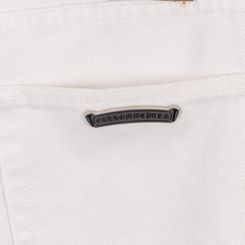 White denim pants with metal brand tab on front pocket