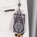 White denim pants with leopard cross patches and belt loop detail