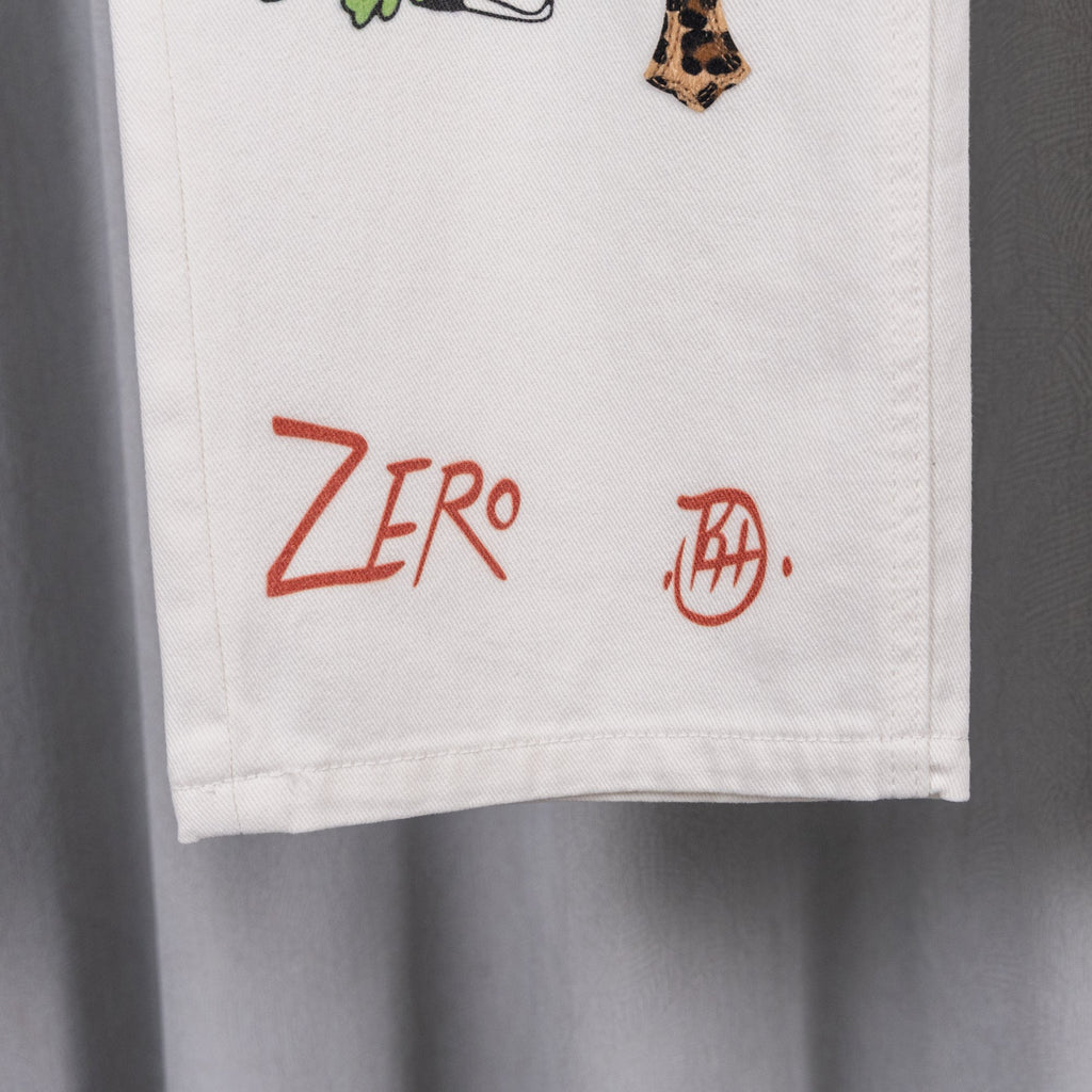 White denim pants with red logo print and small side mark