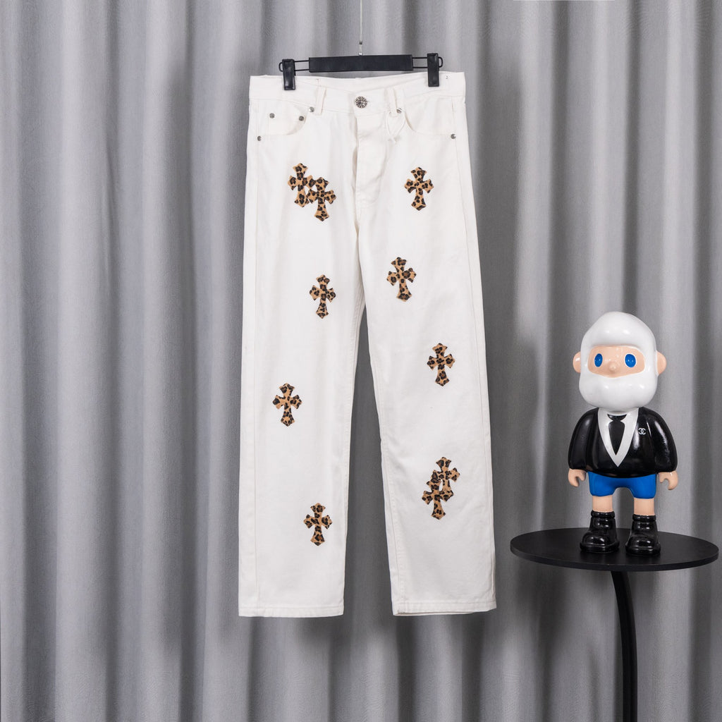 White denim pants with small leopard-print cross patches on the front legs