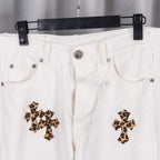White denim pants waistband with metal button and leopard-print cross patches