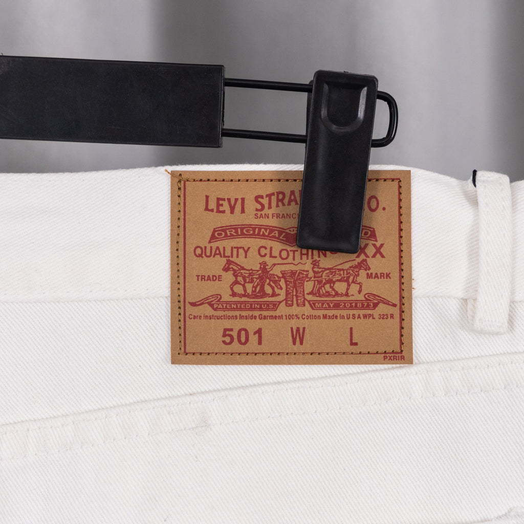 White denim pants inside waistband label reading Levi Strauss & Co.