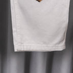 White denim pants hem and side seam