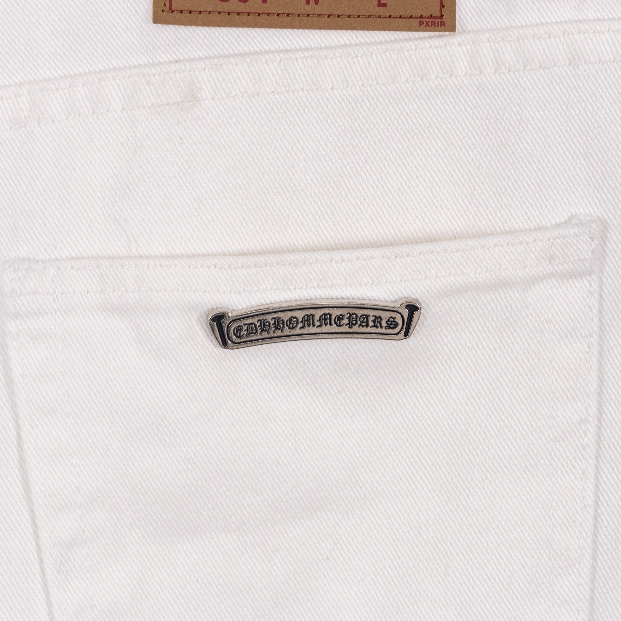White pants with logo patch on waistband