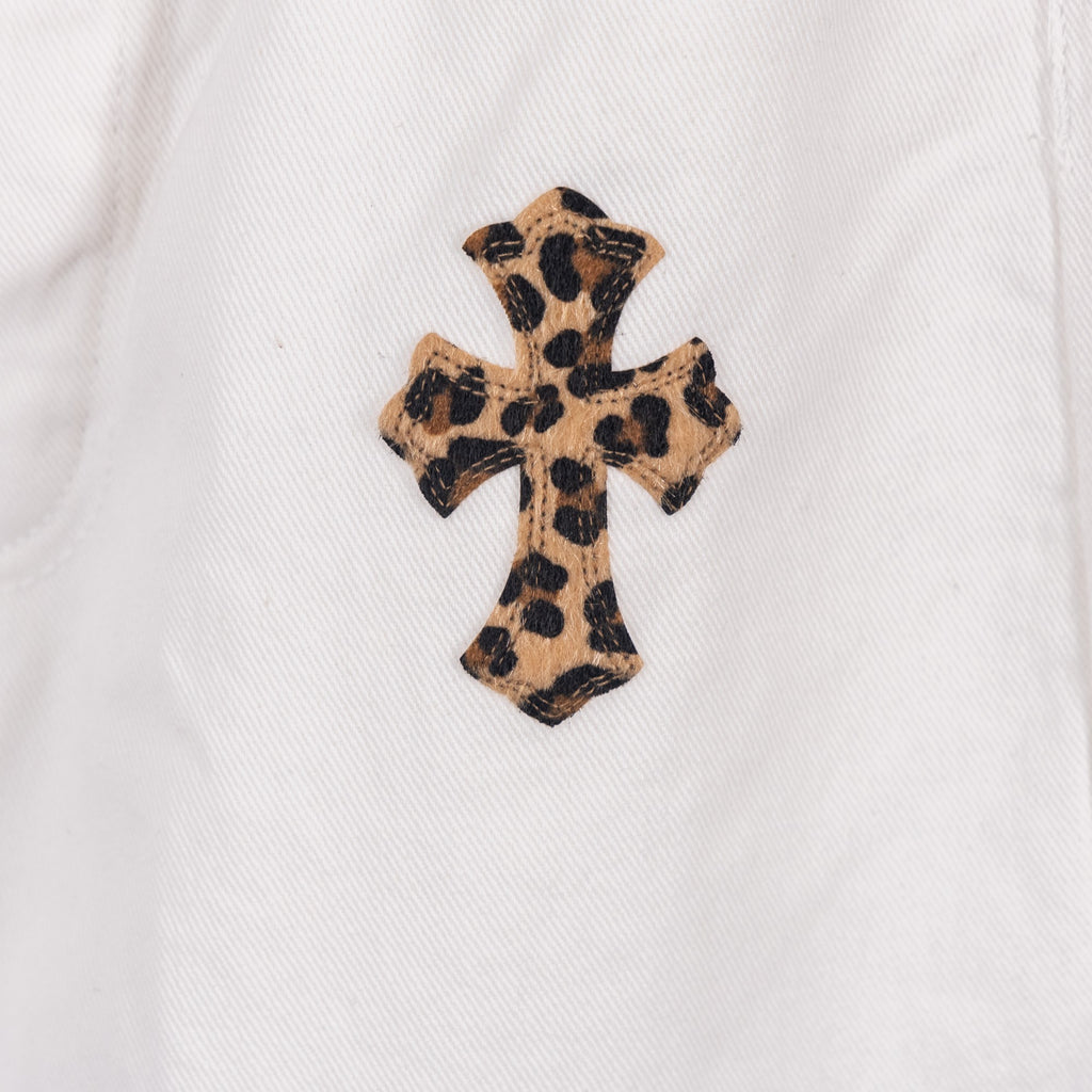 White pants with leopard-print cross appliqué on front