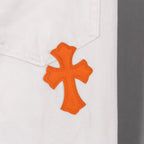 Orange cross applique on white denim pants