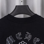 Black crew-neck T-shirt with partial neckline and scattered white cross emblems