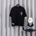 Black short-sleeve graphic T-shirt with small cross emblem on the chest