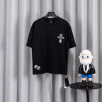 Black short-sleeve graphic T-shirt with small cross emblem on the chest
