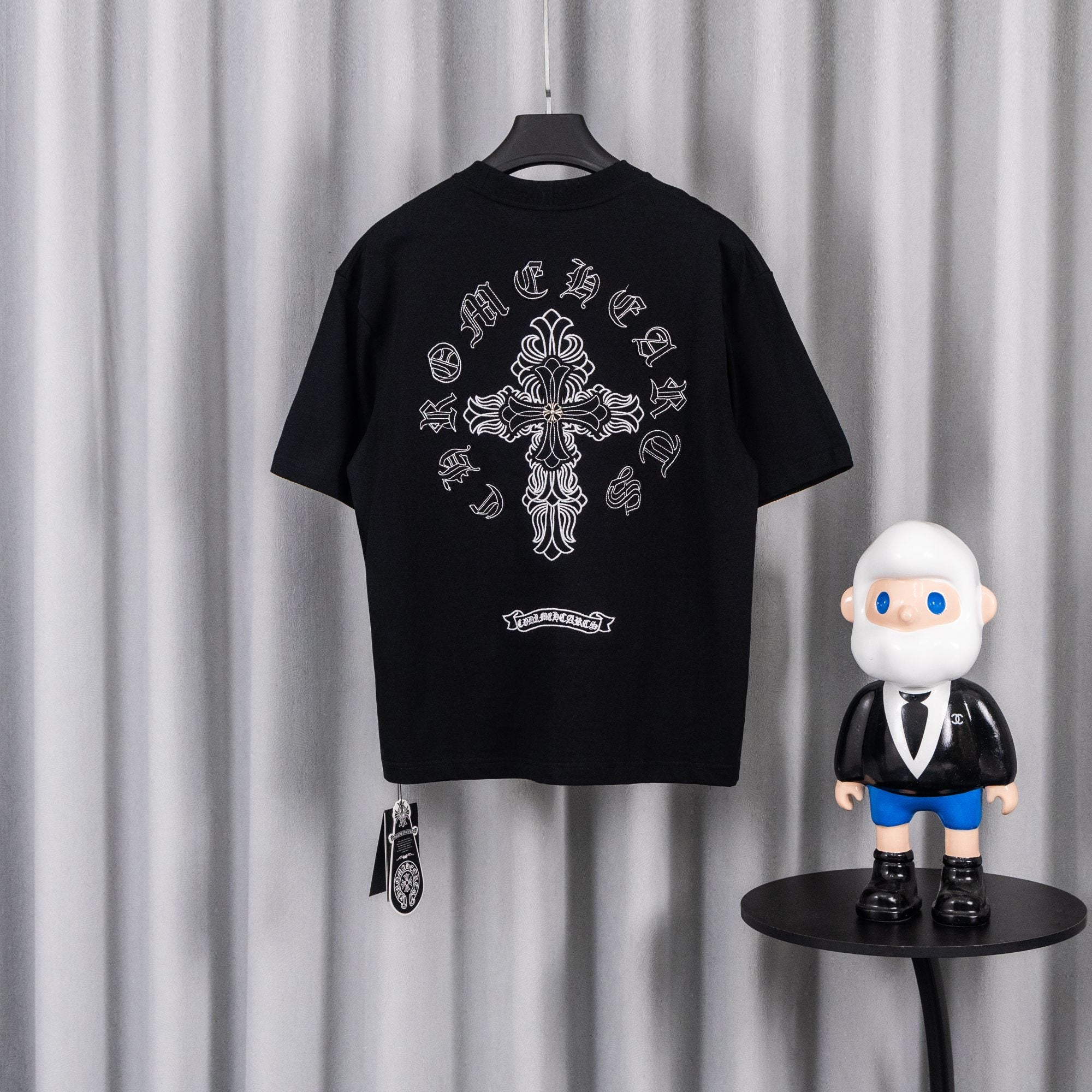 Black short-sleeve graphic T-shirt with large back cross and ribbon embroidery