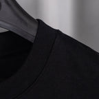 Black crew-neck top with ribbed collar and stitching