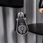 Black garment with white crest logo hang tag