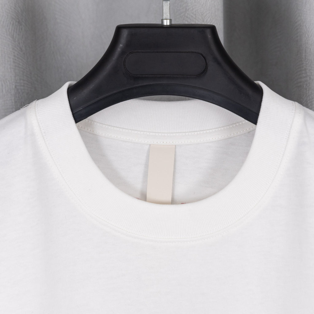 White crew-neck T-shirt with round neckline close-up