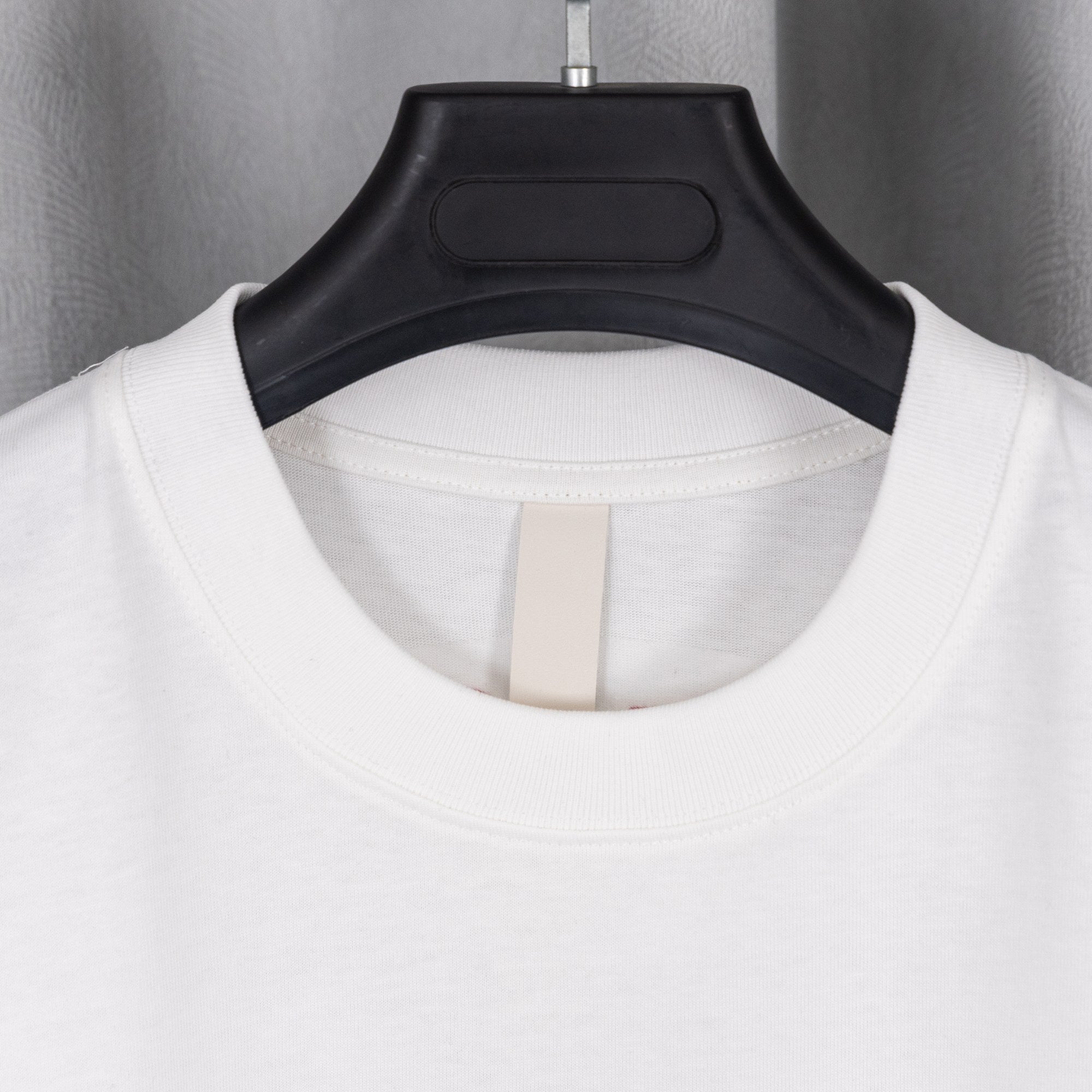 White crew-neck T-shirt with round neckline close-up
