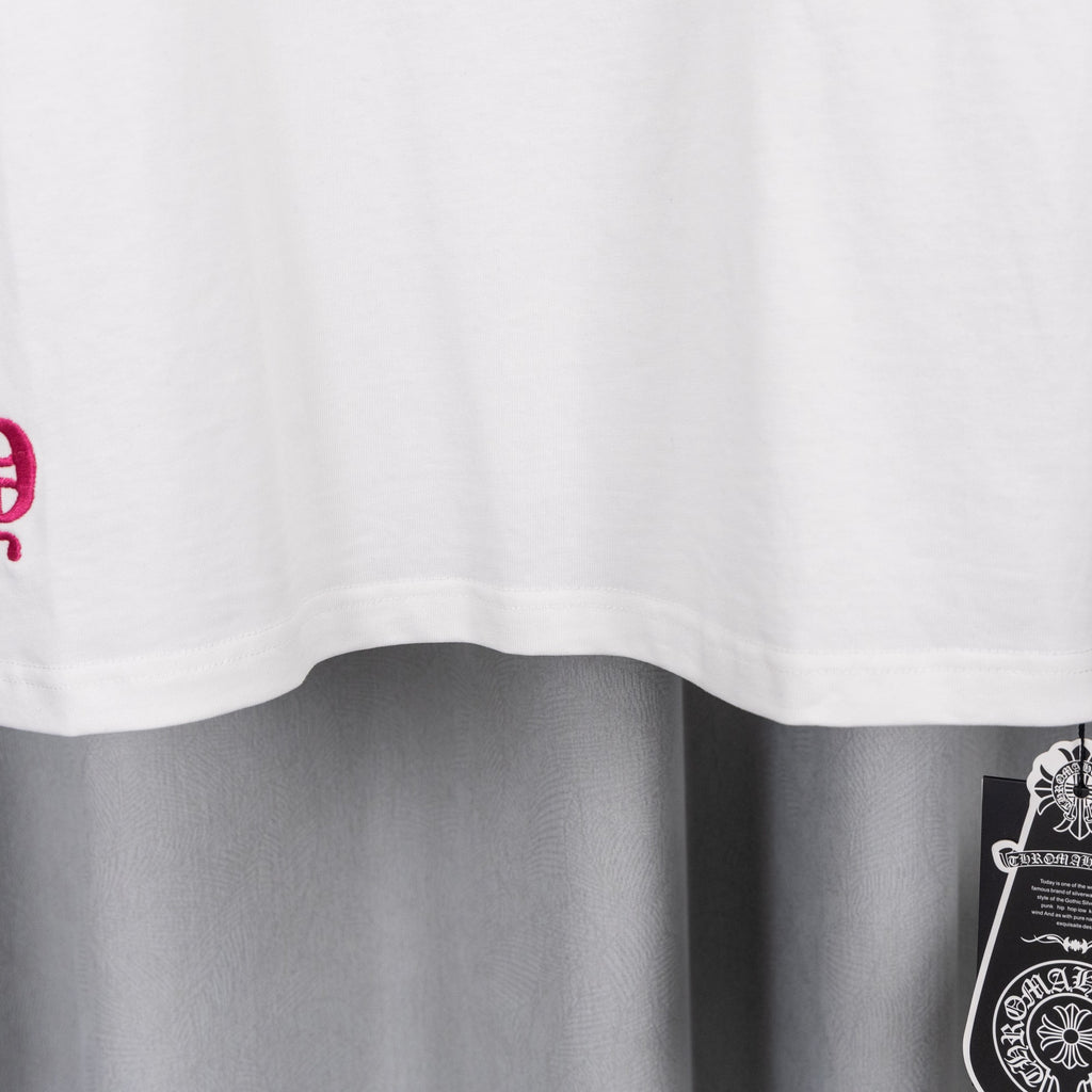 White T-shirt with curved hem and partial pink graphic print