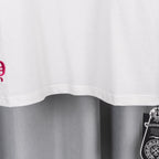 White T-shirt with curved hem and partial pink graphic print